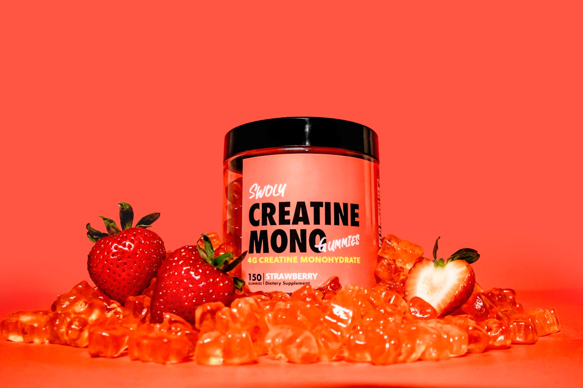 a jar of creatin monoc next to some strawberries